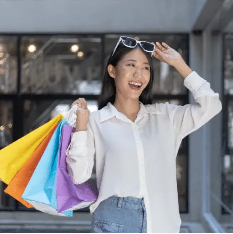 Girl is happy while shopping in the mall