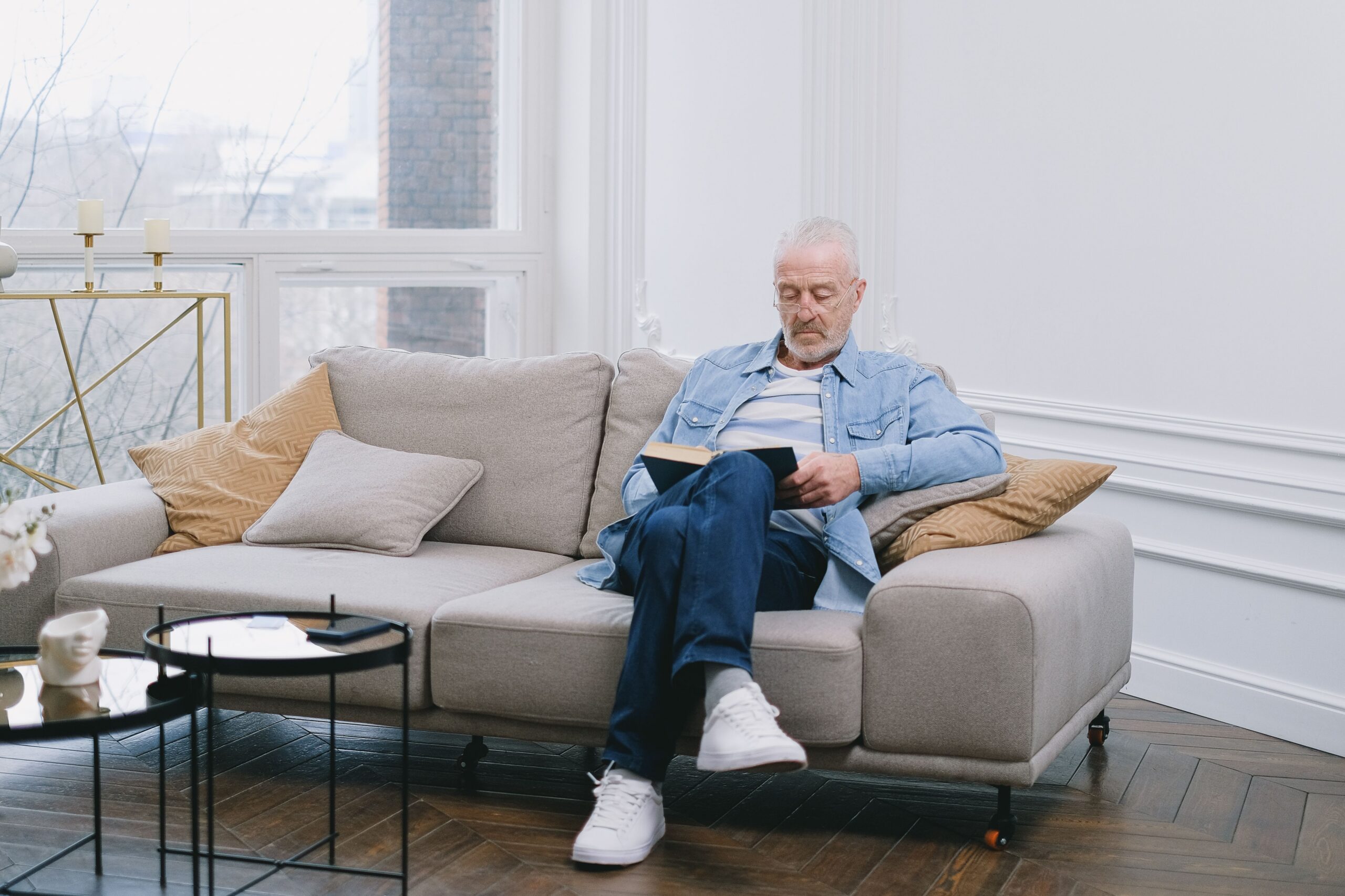 senior sitting on couch